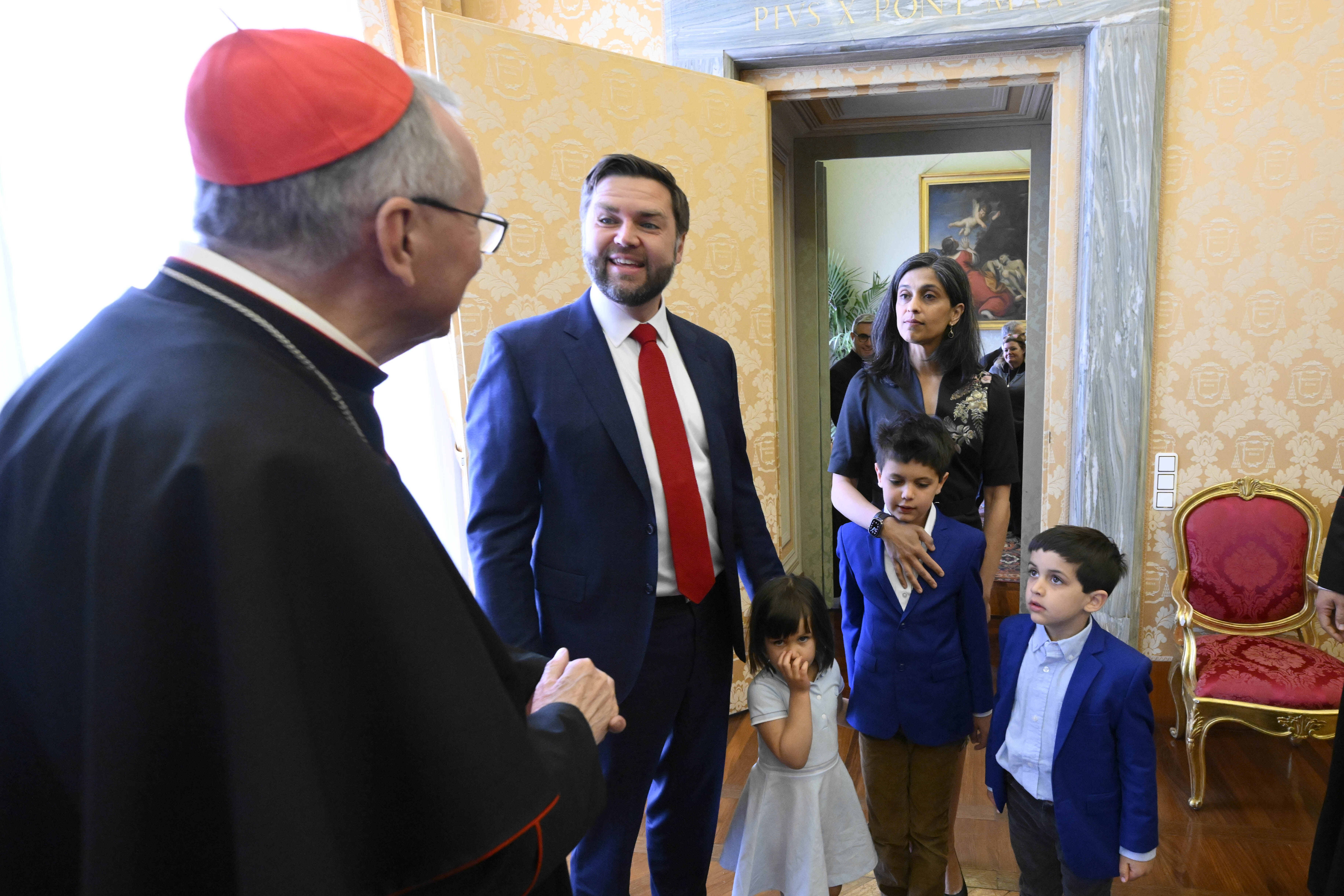 From left, Vatican Secretary of State Cardinal Pietro Parolin meets with U.S. Vice President JD Vance, his daughter Mirabel, his wife Usha, and their sons Ewan and Vivek at the Vatican, Saturday, April 19, 2025. (Vatican Media via AP, HO)