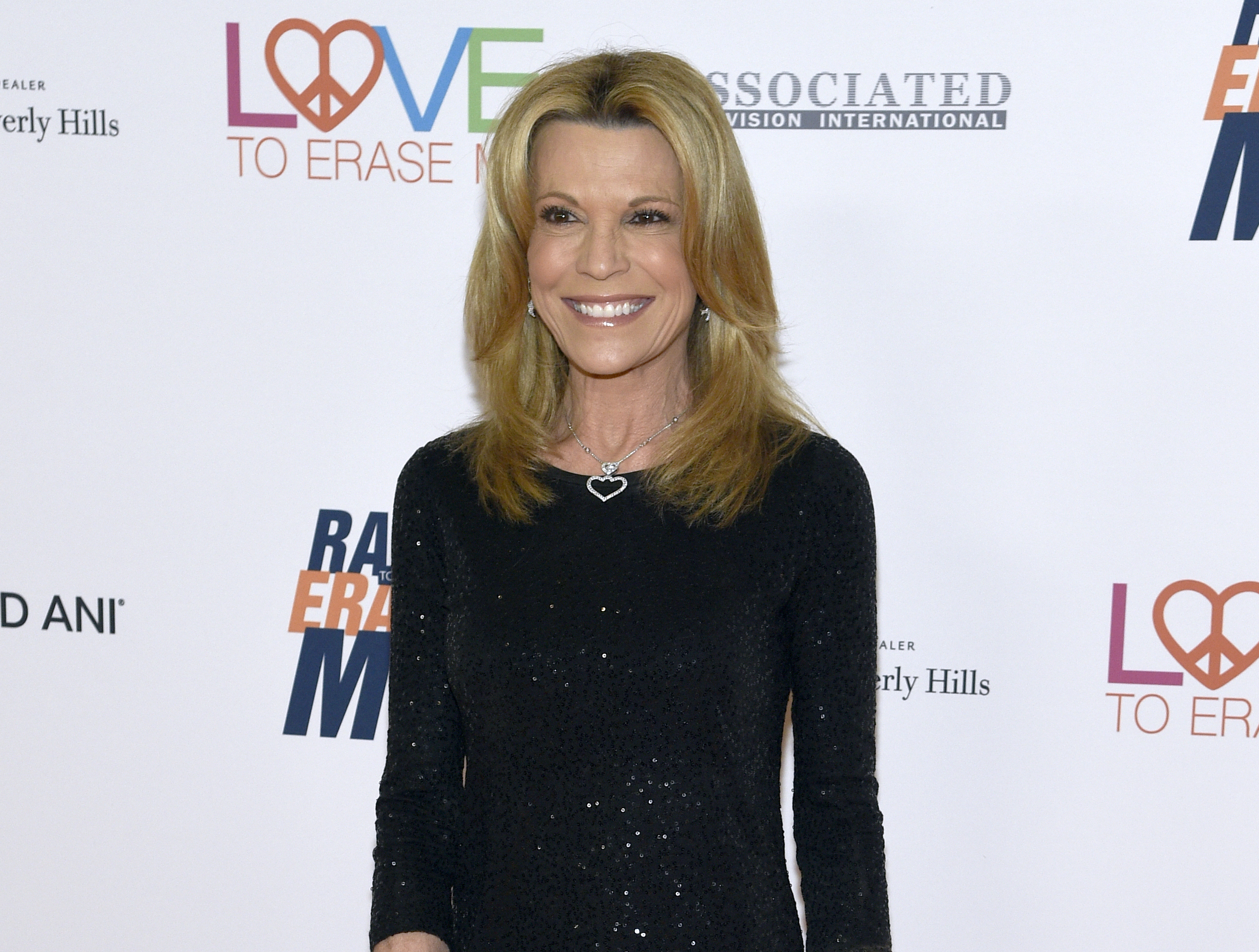 FILE - Game show personality Vanna White appears at the 25th annual Race to Erase MS Gala in Beverly Hills, Calif., on April 20, 2018. White will remain with "Wheel of Fortune'' for two additional seasons. (Photo by Chris Pizzello/Invision/AP, File)