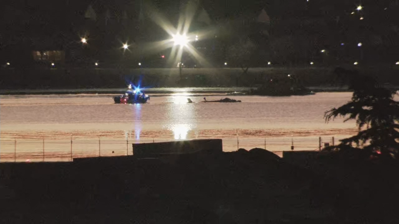 Crews work to recover a military helicopter and American Airlines plane on Jan. 30, 2025, after a mid-air crash over the Potomac River in D.C. near Reagan National Airport on Jan. 29. (Ben Rice/7News)