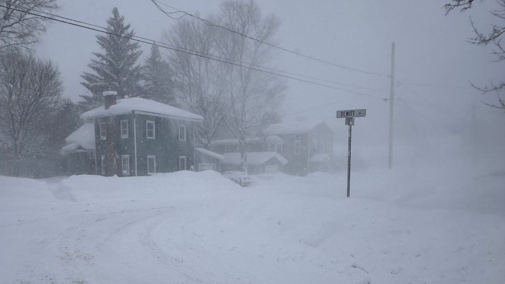 Strong winds kick up snow in Lowville, New York, on Friday, Jan. 23, 2026. (AP Photo/Cara Anna)