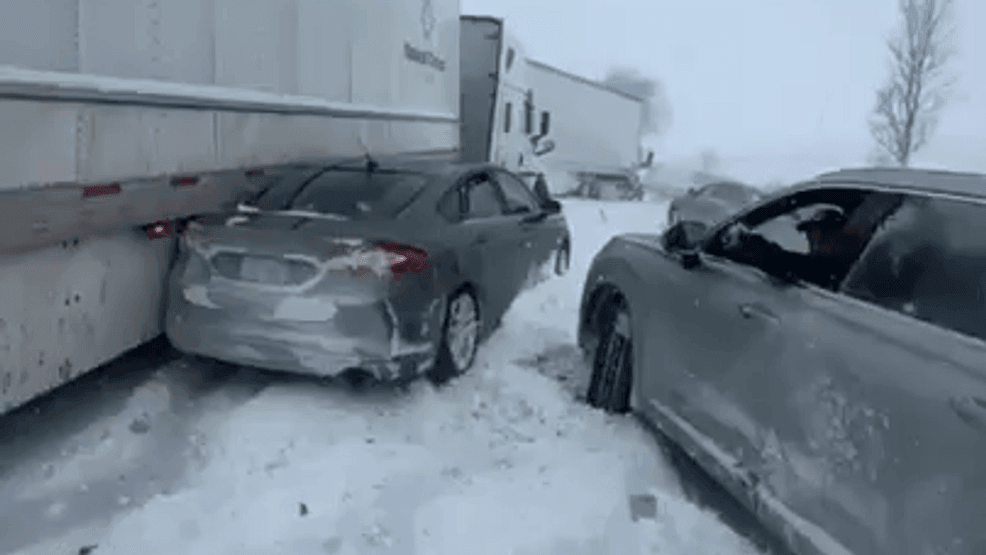 Image for story: Jackknifed semis, 100 car pileup shuts down I-196; stranded drivers bussed from crash site