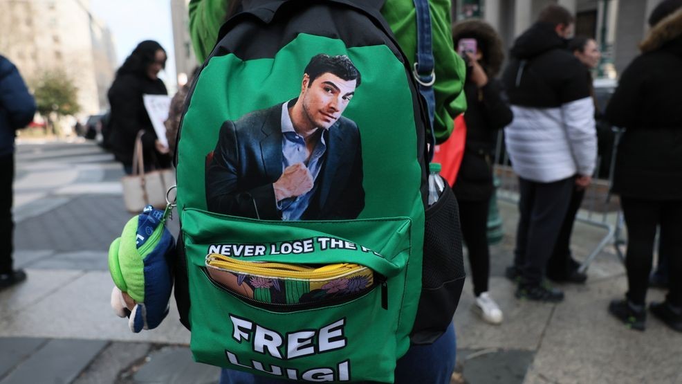 NEW YORK, NEW YORK - JANUARY 09: Supporters of Luigi Mangione wait in line to enter Manhattan Federal Court on January 09, 2026 in New York City. Lawyers for Mangione attorneys are in court for the 27-year-old accused killer to try to avoid the death penalty in the fatal shooting of Brian Thompson, UnitedHealthcare’s top executive in 2024. (Photo by Michael M. Santiago/Getty Images)