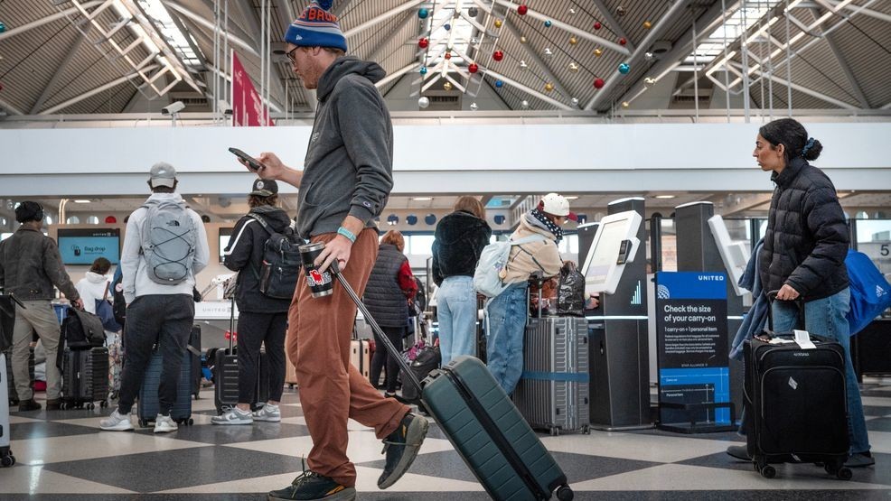 Image for story: Man arrested after attempting to board flight with dead wife in wheelchair