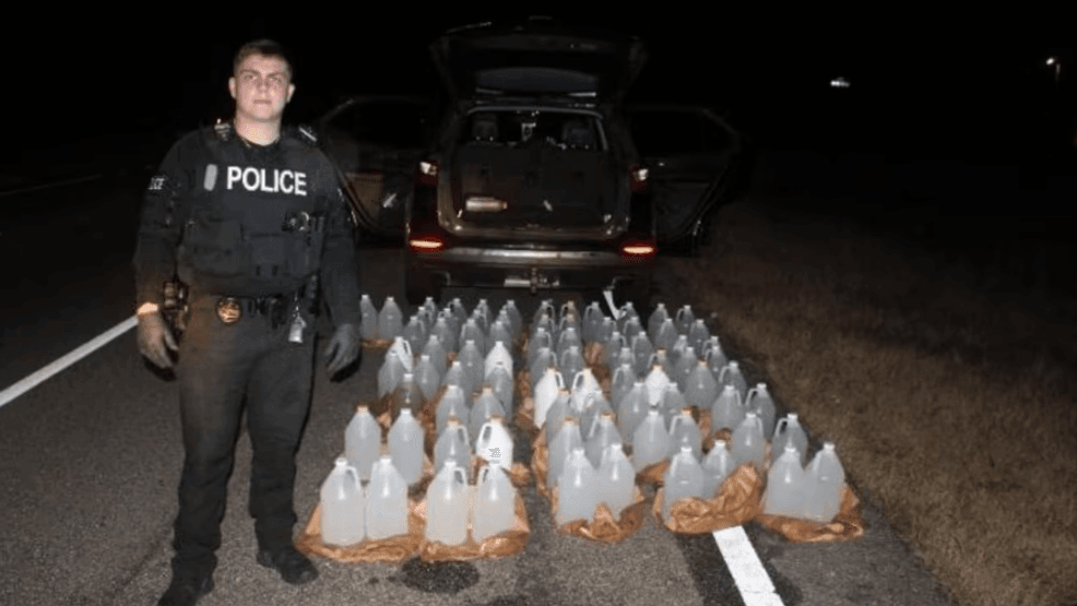 Image for story: Florida man stopped in Alabama with 81 gallons of moonshine, police say